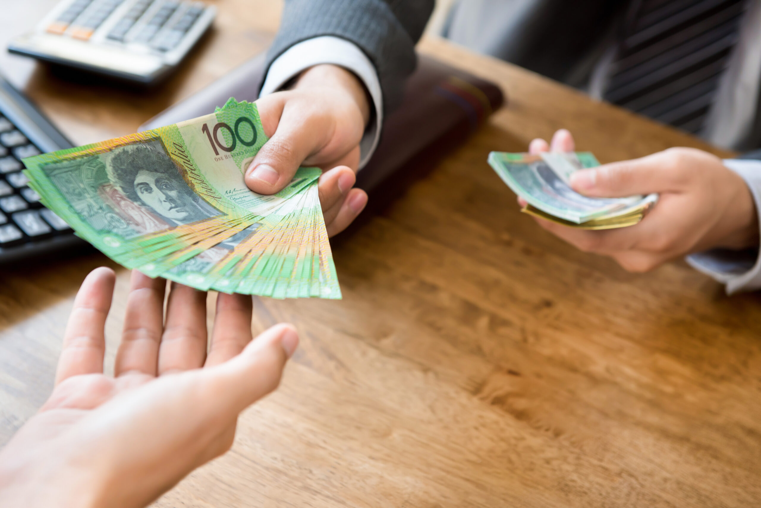 Businessman,As,An,Employer,Paying,Cash,(australian,Dollar,Money),To